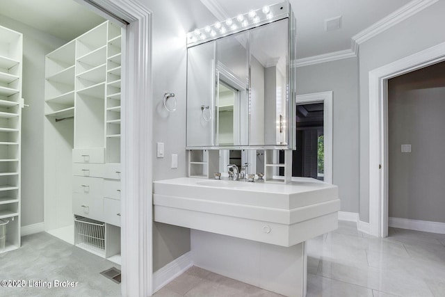 603 Woodlake Dr, Louisville, KY 40245 - bathroom with ornamental molding, baseboards, a spacious closet, and vanity