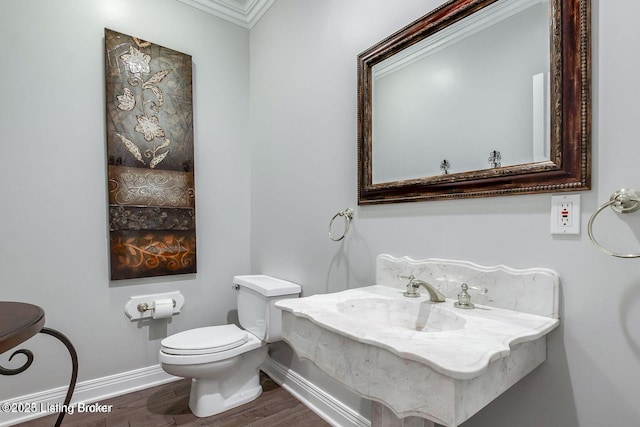 603 Woodlake Dr, Louisville, KY 40245 - bathroom featuring wood finished floors, baseboards, and toilet