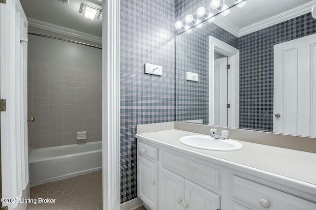 603 Woodlake Dr, Louisville, KY 40245 - full bathroom featuring crown molding, vanity, tile patterned floors, bathing tub / shower combination, and wallpapered walls