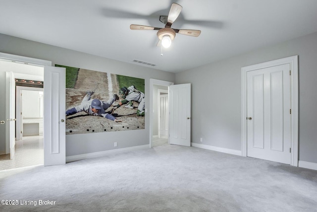 603 Woodlake Dr, Louisville, KY 40245 - unfurnished bedroom with carpet floors, baseboards, and ceiling fan