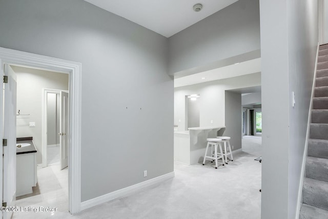 603 Woodlake Dr, Louisville, KY 40245 - carpeted empty room with stairway, a smoke detector, and baseboards