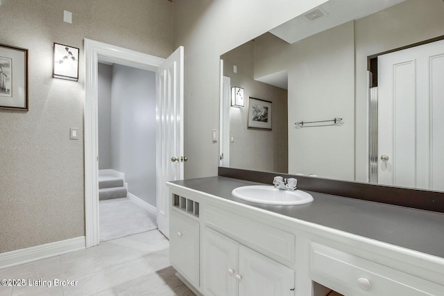 603 Woodlake Dr, Louisville, KY 40245 - bathroom featuring vanity, baseboards, and tile patterned floors