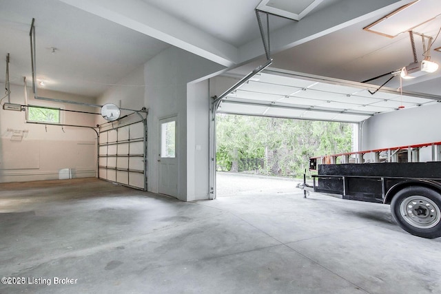 603 Woodlake Dr, Louisville, KY 40245 - garage featuring a garage door opener
