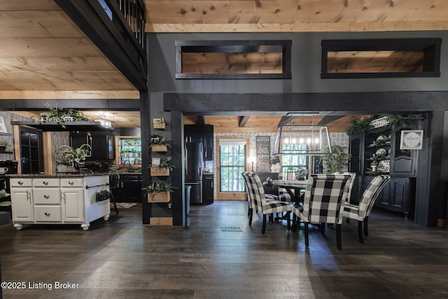 282 Lakeview Ln, Mcdaniels, KY 40152 - dining space featuring a chandelier and dark wood-style flooring
