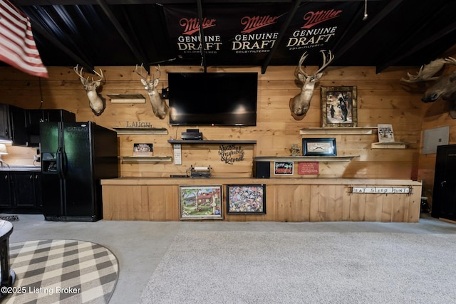 282 Lakeview Ln, Mcdaniels, KY 40152 - kitchen with black fridge and wood walls
