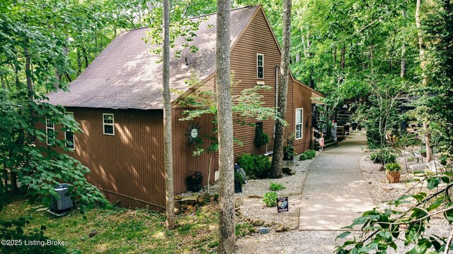 282 Lakeview Ln, Mcdaniels, KY 40152 - view of side of home with a shingled roof and cooling unit