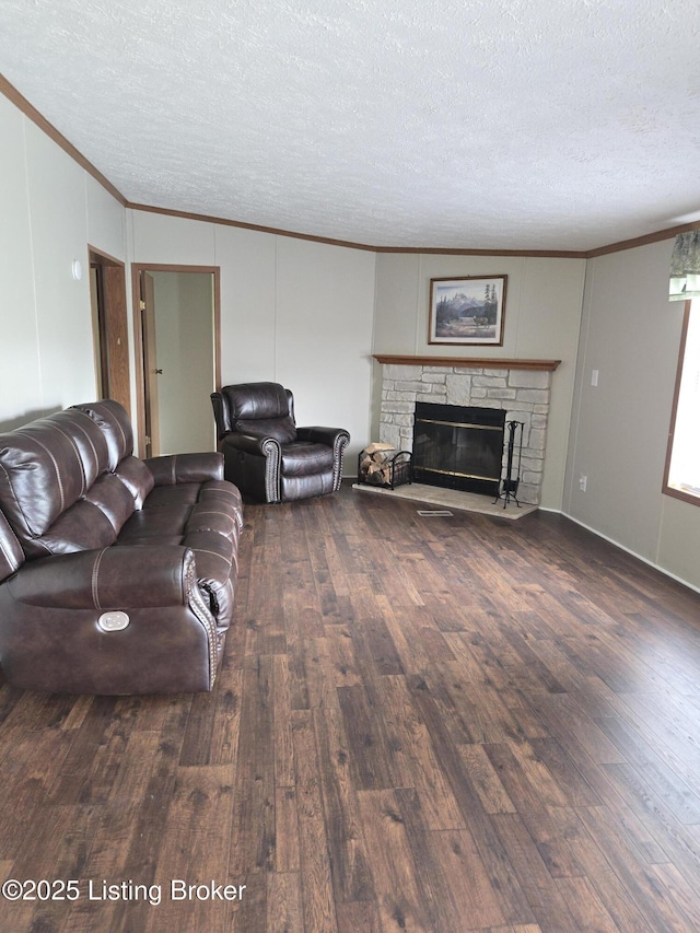 2131 Ridge Rd, Shepherdsville, KY 40165 - living area with crown molding, wood finished floors, a textured ceiling, a fireplace, and a decorative wall