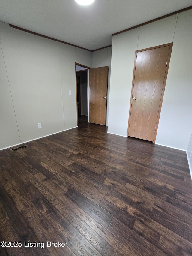 2131 Ridge Rd, Shepherdsville, KY 40165 - unfurnished bedroom featuring wood finished floors and crown molding