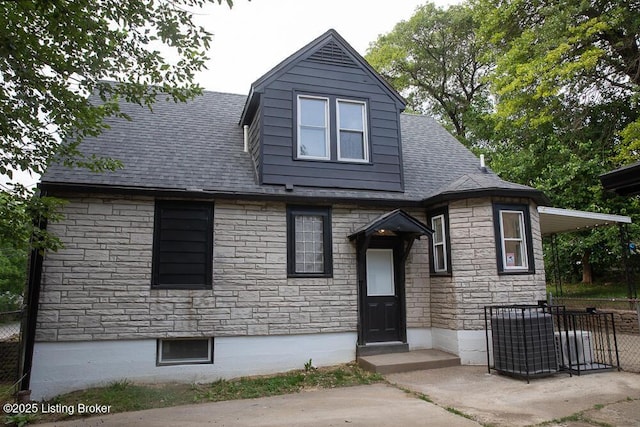 1436 Huntoon Ave, Louisville, KY 40215 - view of front facade featuring stone siding and roof with shingles