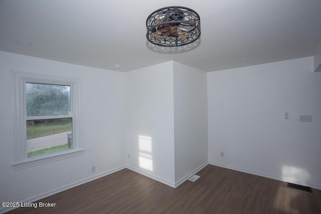 1436 Huntoon Ave, Louisville, KY 40215 - spare room with dark wood-style floors and baseboards
