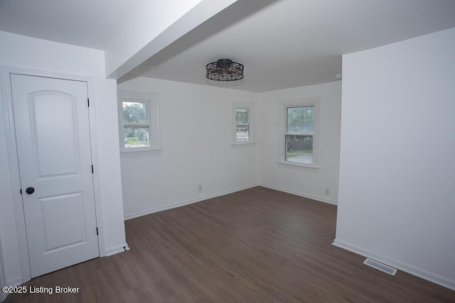1436 Huntoon Ave, Louisville, KY 40215 - spare room with dark wood finished floors, plenty of natural light, and baseboards