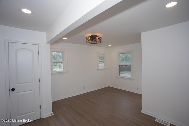 1436 Huntoon Ave, Louisville, KY 40215 - unfurnished room with healthy amount of natural light, dark wood-type flooring, recessed lighting, and baseboards