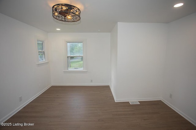 1436 Huntoon Ave, Louisville, KY 40215 - empty room featuring dark wood-type flooring, baseboards, and recessed lighting