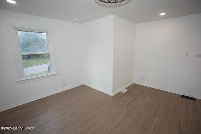 1436 Huntoon Ave, Louisville, KY 40215 - spare room featuring wood finished floors, baseboards, and recessed lighting