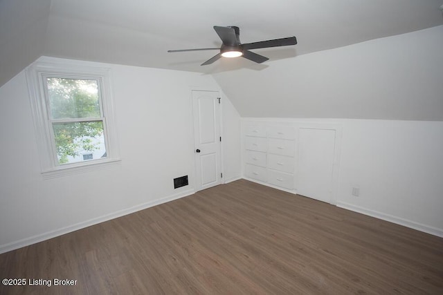 1436 Huntoon Ave, Louisville, KY 40215 - additional living space with dark wood finished floors, vaulted ceiling, ceiling fan, and baseboards