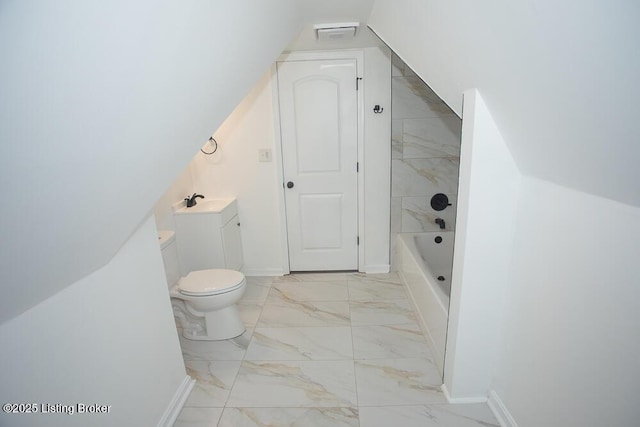 1436 Huntoon Ave, Louisville, KY 40215 - bathroom featuring marble finish flooring, toilet, a bathtub, and baseboards
