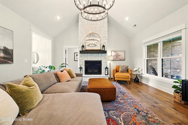 131 Gavin Dr, Shepherdsville, KY 40165 - living area featuring a chandelier, wood finished floors, high vaulted ceiling, a stone fireplace, and recessed lighting