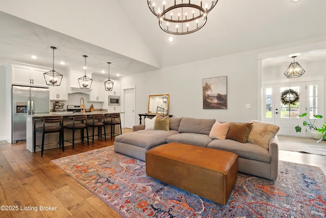 131 Gavin Dr, Shepherdsville, KY 40165 - living room with hardwood / wood-style flooring, a chandelier, recessed lighting, and high vaulted ceiling
