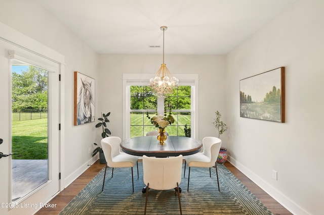 131 Gavin Dr, Shepherdsville, KY 40165 - dining area featuring plenty of natural light, a chandelier, and dark wood-style floors