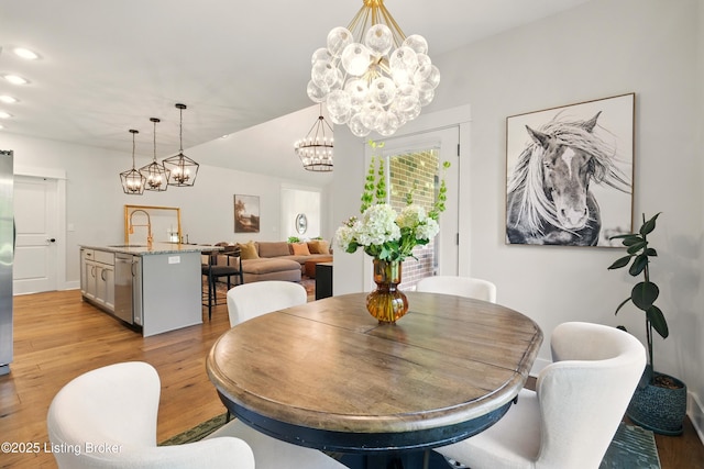 131 Gavin Dr, Shepherdsville, KY 40165 - dining space featuring a chandelier, light wood-style floors, and recessed lighting