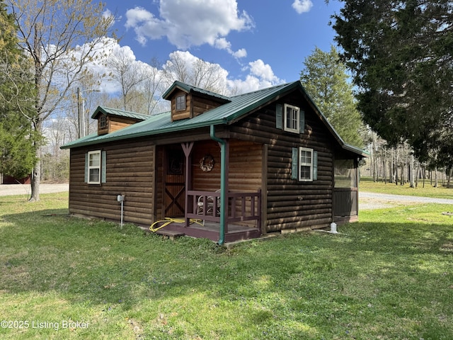 661 Blue Bird Rd, Falls Of Rough, KY 40119 - view of side of home with faux log siding, a yard, and metal roof
