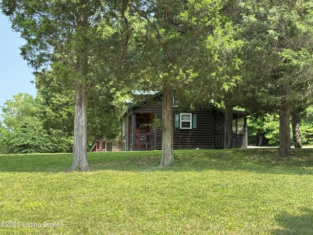 661 Blue Bird Rd, Falls Of Rough, KY 40119 - view of front of home with faux log siding and a front yard