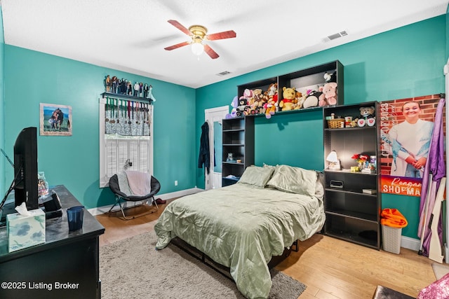 177 Airport Rd, Leitchfield, KY 42754 - bedroom featuring wood finished floors, a ceiling fan, and baseboards