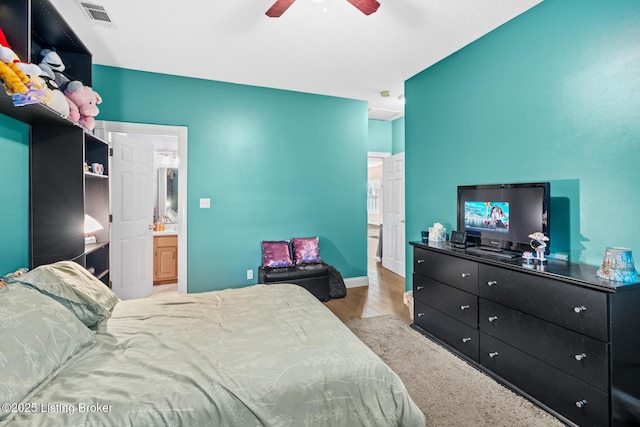 177 Airport Rd, Leitchfield, KY 42754 - bedroom with wood finished floors, ensuite bathroom, baseboards, and ceiling fan