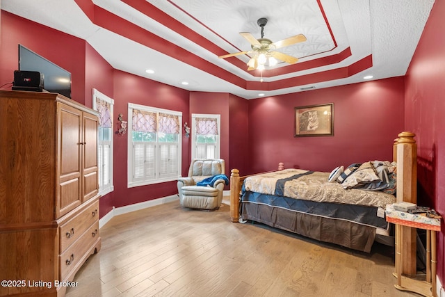 177 Airport Rd, Leitchfield, KY 42754 - bedroom featuring a raised ceiling, wood finished floors, and baseboards