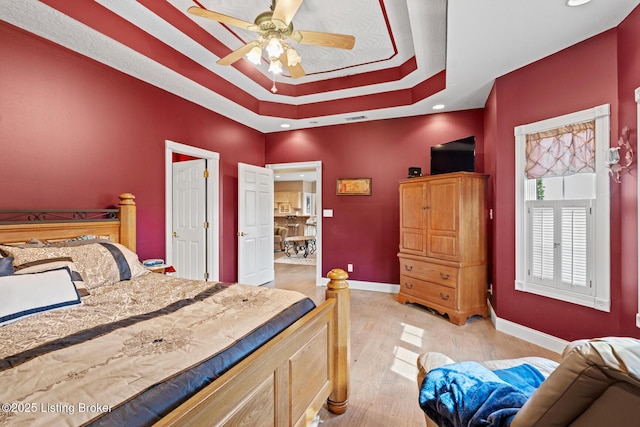 177 Airport Rd, Leitchfield, KY 42754 - bedroom featuring a tray ceiling, baseboards, light wood-type flooring, a ceiling fan, and recessed lighting