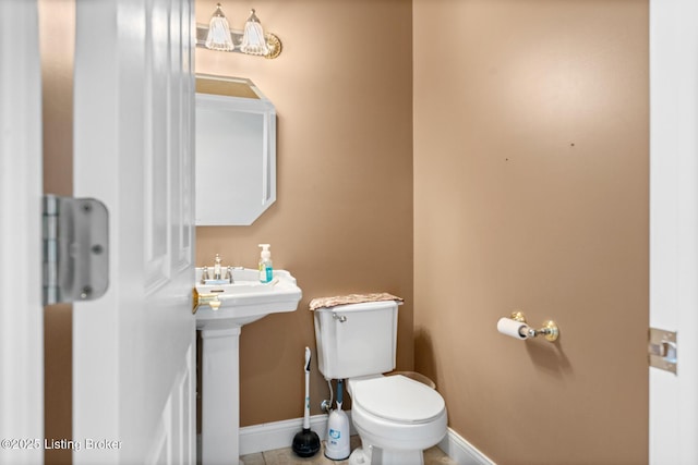 177 Airport Rd, Leitchfield, KY 42754 - bathroom featuring toilet, baseboards, and tile patterned flooring