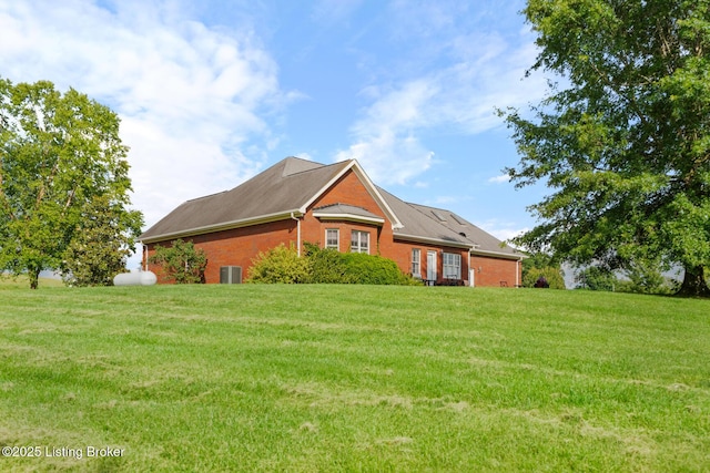 177 Airport Rd, Leitchfield, KY 42754 - view of home's exterior with brick siding, a yard, and central AC unit