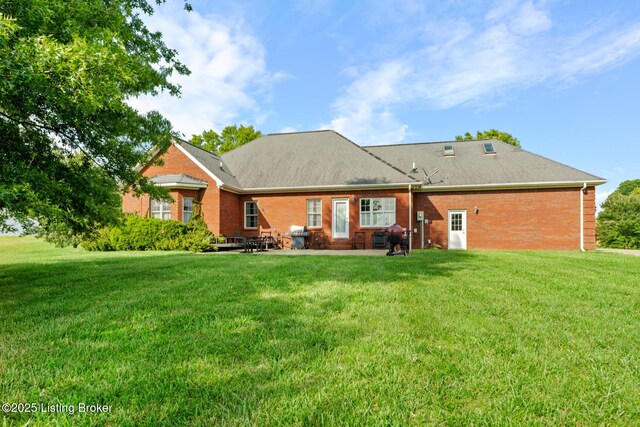 177 Airport Rd, Leitchfield, KY 42754 - rear view of house with brick siding, a yard, and a patio
