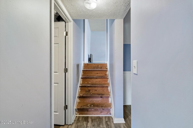 6600 Musket Dr, Louisville, KY 40228 - staircase with wood finished floors and a textured ceiling
