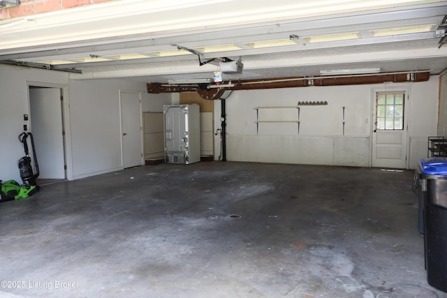 502 Hill Ridge Rd, Louisville, KY 40214 - garage featuring a garage door opener and refrigerator