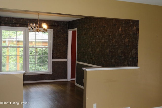 502 Hill Ridge Rd, Louisville, KY 40214 - unfurnished dining area featuring a chandelier and wood finished floors