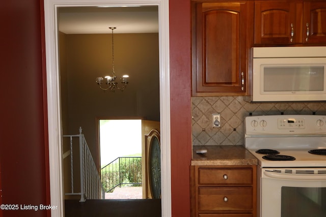 502 Hill Ridge Rd, Louisville, KY 40214 - kitchen featuring white appliances, backsplash, a chandelier, light countertops, and pendant lighting