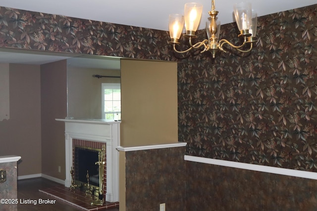 502 Hill Ridge Rd, Louisville, KY 40214 - unfurnished dining area featuring a chandelier, a brick fireplace, and wallpapered walls