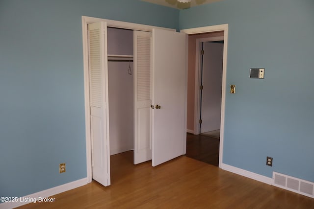 502 Hill Ridge Rd, Louisville, KY 40214 - unfurnished bedroom with wood finished floors and a closet