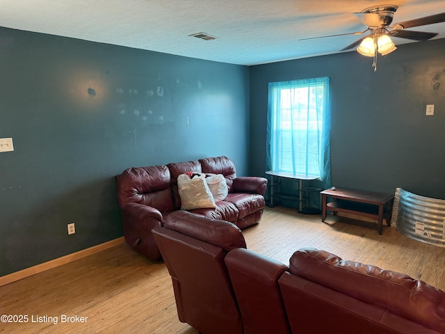 775 Constantine Vertrees Rd, Garfield, KY 40140 - living area with light wood-style flooring, ceiling fan, and baseboards