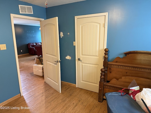 775 Constantine Vertrees Rd, Garfield, KY 40140 - bedroom with light wood-style flooring and baseboards