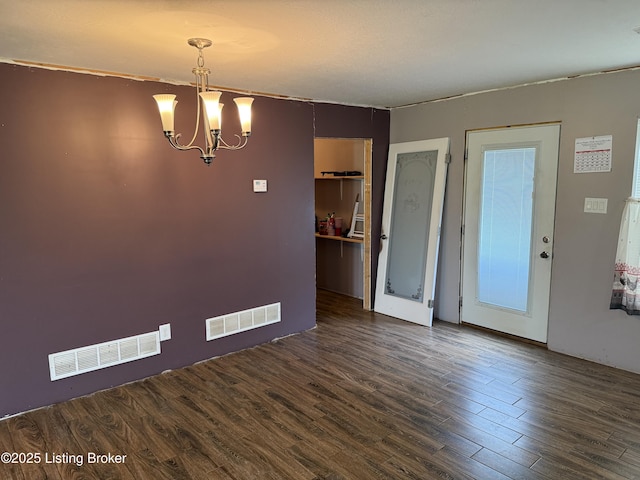 775 Constantine Vertrees Rd, Garfield, KY 40140 - unfurnished dining area featuring wood finished floors and a chandelier