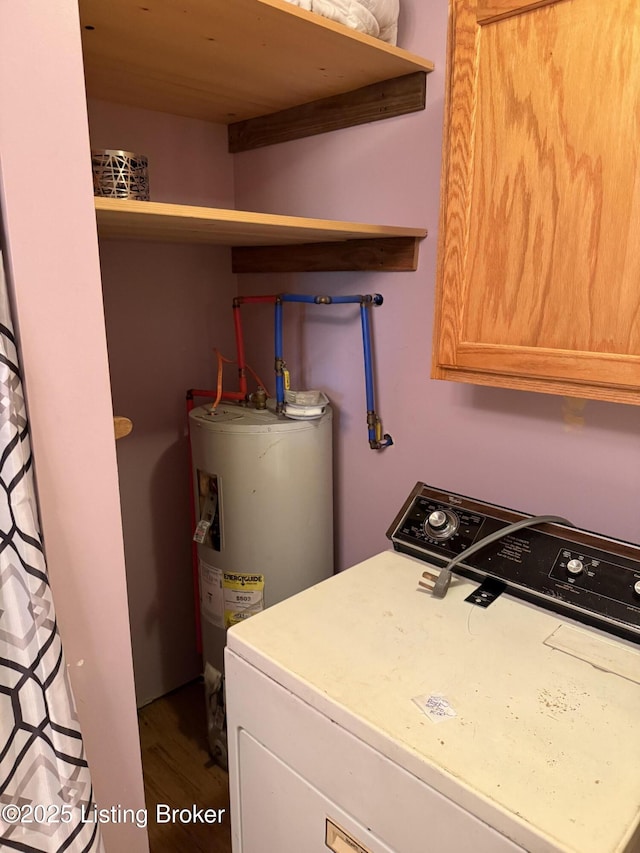 775 Constantine Vertrees Rd, Garfield, KY 40140 - washroom featuring washer / clothes dryer, cabinet space, electric water heater, and wood finished floors