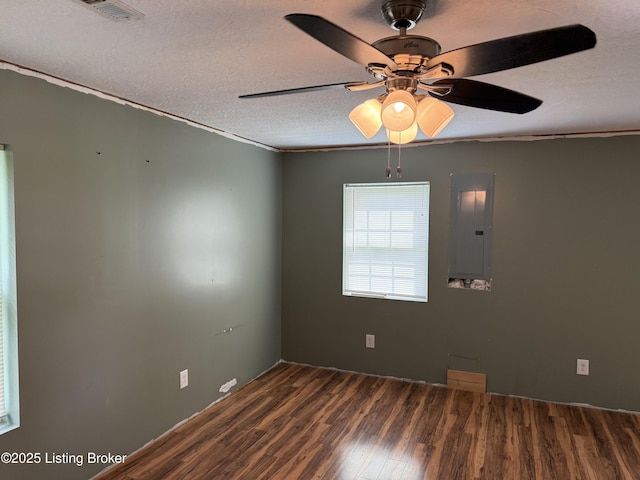 775 Constantine Vertrees Rd, Garfield, KY 40140 - unfurnished room featuring wood finished floors, a ceiling fan, electric panel, a textured ceiling, and crown molding
