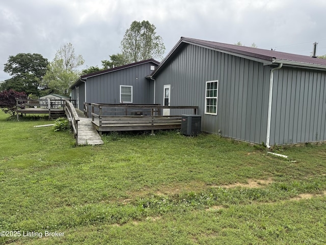 775 Constantine Vertrees Rd, Garfield, KY 40140 - rear view of property featuring a deck, central air condition unit, a lawn, and board and batten siding