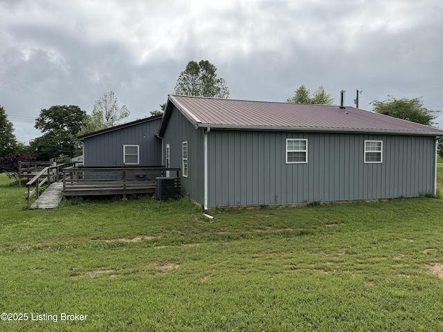 775 Constantine Vertrees Rd, Garfield, KY 40140 - view of home's exterior featuring cooling unit, a deck, a lawn, and metal roof