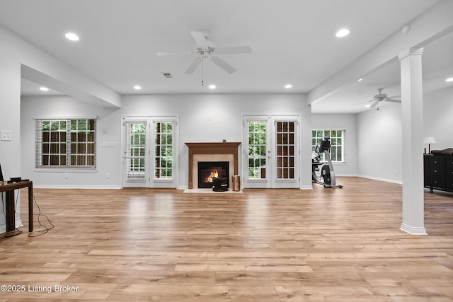 4107 Dolphin Rd, Louisville, KY 40220 - unfurnished living room with ceiling fan, recessed lighting, light wood-type flooring, a fireplace, and healthy amount of natural light