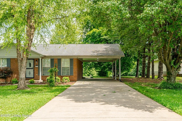 1117 Breezy Way, Bardstown, KY 40004 - single story home with brick siding, a front yard, concrete driveway, an attached carport, and a shingled roof