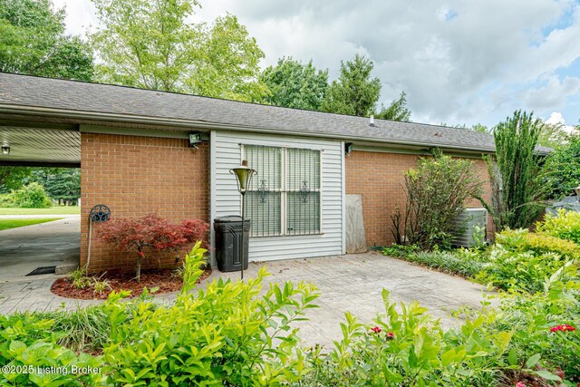 1117 Breezy Way, Bardstown, KY 40004 - back of property with brick siding and a patio area