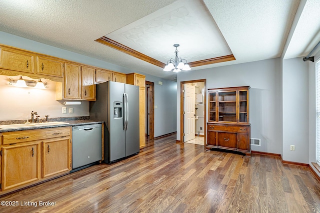 1117 Breezy Way, Bardstown, KY 40004 - kitchen featuring appliances with stainless steel finishes, a chandelier, a tray ceiling, a textured ceiling, and wood finished floors